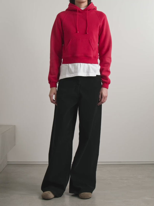 The Timmi cotton-blend jersey hoodie by The Row redefines casual elegance. Crafted from soft fleece-backed cotton blend, it offers exceptional comfort with refined texture. Its cropped silhouette pairs impeccably with high-rise jeans or trousers, while the practical kangaroo pocket adds subtle functionality. Perfect for those seeking understated sophistication in everyday wear.