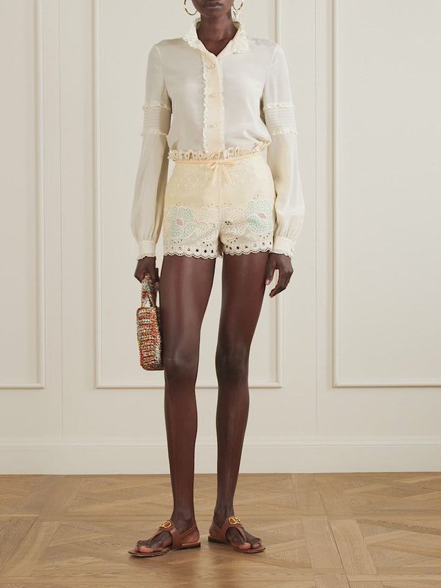 Valentino Garavani captures vintage-inspired sophistication in these exquisite shorts. Crafted from premium broderie anglaise cotton, they feature intricate lace embroidery and a charming bow accent that elevates any wardrobe with understated luxury and timeless appeal.