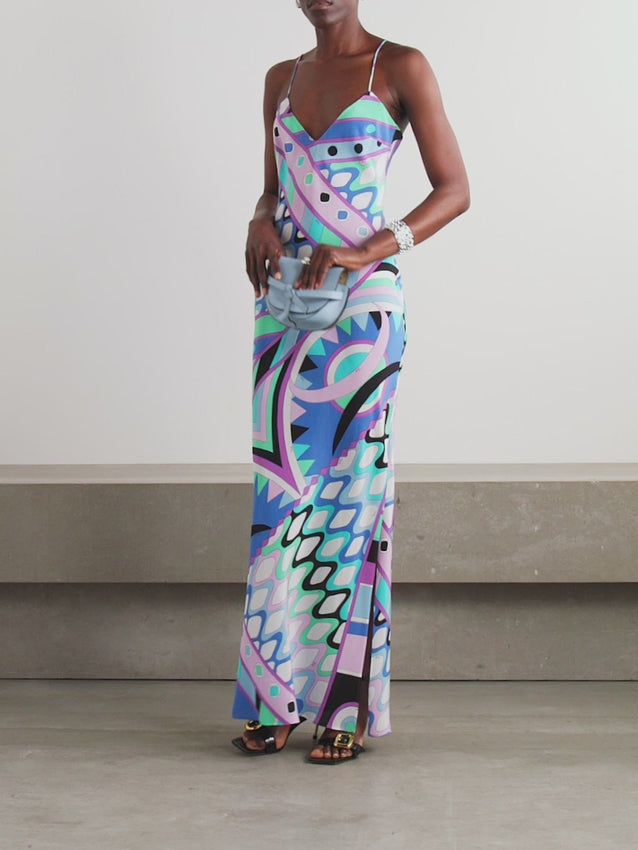 Discover timeless elegance with this exquisite silk crepe de chine maxi dress, reimagined by Creative Director Camille Miceli. Featuring PUCCI's iconic 'Vivara' archival print, this sophisticated piece combines heritage craftsmanship with contemporary design. The refined slip silhouette gracefully contours your silhouette while the flattering V-neckline invites layering with delicate jewelry. Perfect for elevated occasions where refined taste meets effortless luxury.