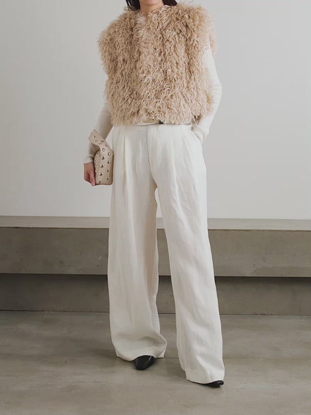 Elevate your layering game with the Florana faux fur vest, a luxurious piece that seamlessly blends contemporary style with timeless elegance. Crafted from sumptuous faux fur, this vest delivers the opulence of real fur without compromise. Its versatile silhouette pairs effortlessly over dresses, sweaters, or lightweight tops, making it an essential addition to any refined wardrobe. 