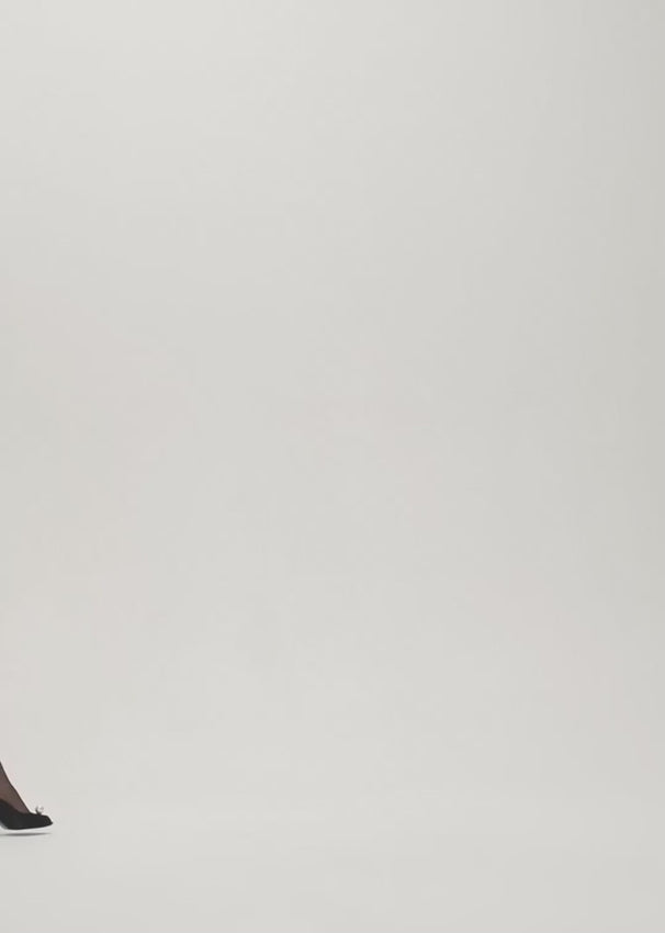 This elegant mini dress by Magda Butrym features a low cut scoop neckline and long sleeves, draped with cascading fabric for a chic and flattering look. The ruched skirt adds texture and the jersey fabric provides comfort. Perfect for any occasion, this cream dress is a must-have for your wardrobe.